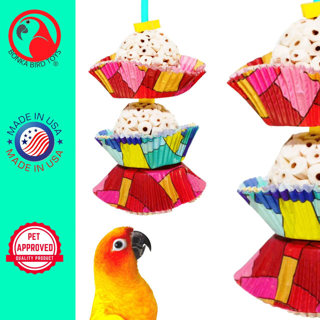 The 1932 Two Cake from Bonka Bird Toys is a colorful and shreddable medium sized bird toy! This toy has (2) natural sola balls and easy to shred colorful cup cakes